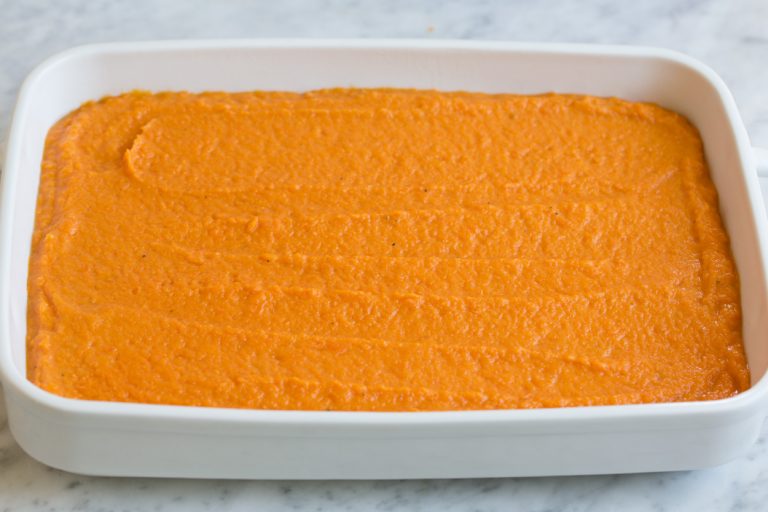 Transfer the mixture into a greased casserole dish and spread it evenly across the surface