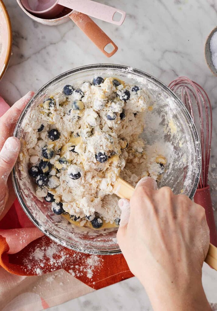 In a separate bowl, whisk together the buttermilk, egg, and vanilla extract. Pour this mixture into the dry ingredients and stir gently with a spatula until a shaggy dough forms. Use your hands to bring everything together, making sure there are no dry pockets. Adjust with a little extra flour if too sticky or a splash of buttermilk if too dry.