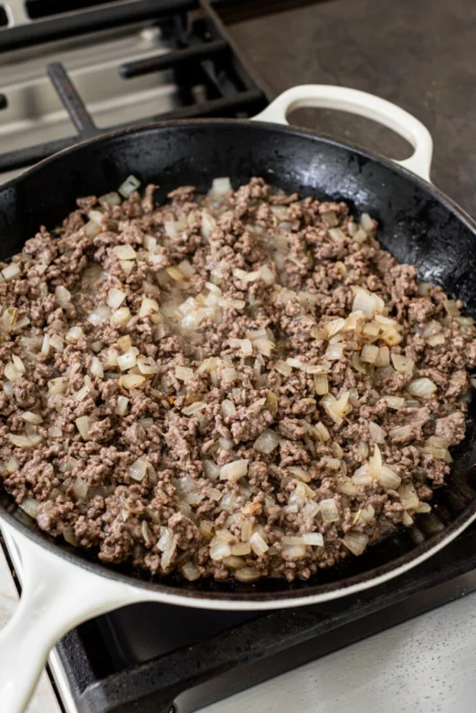 breaking it into small pieces as it cooks until browned and fully cooked through