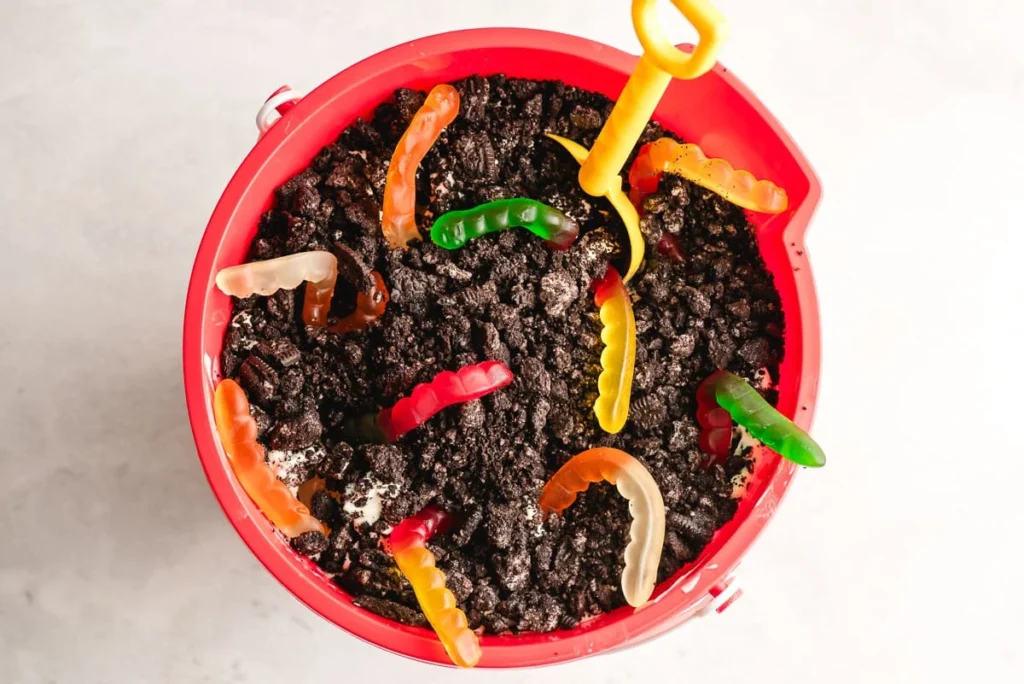 Decorate with gummy worms if desired, then refrigerate for at least four hours or overnight before serving.