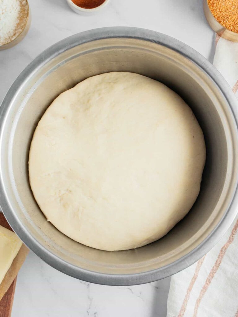 Transfer the dough to a greased bowl, cover, and let it rise in a warm place until doubled in size.